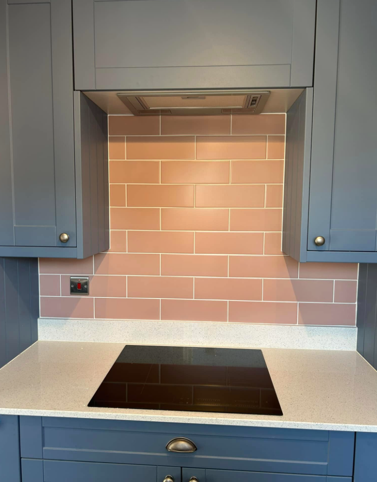 Navy shaker kitchen with blush tiling 1
