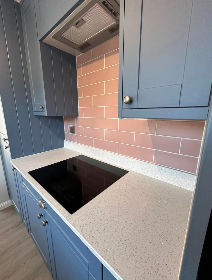 Navy shaker kitchen with blush tiling 4